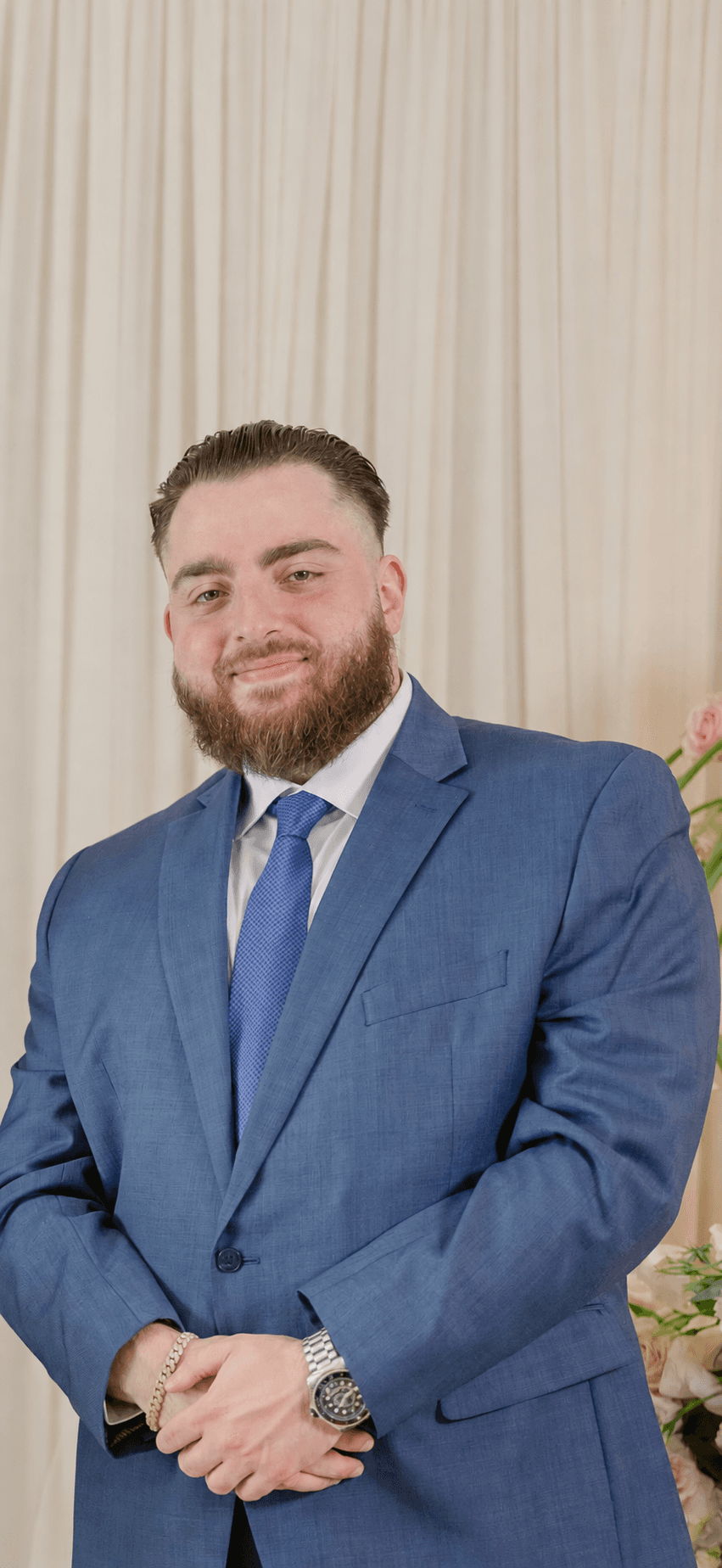 Emmanuel Babakhanlou wearing a blue suit
